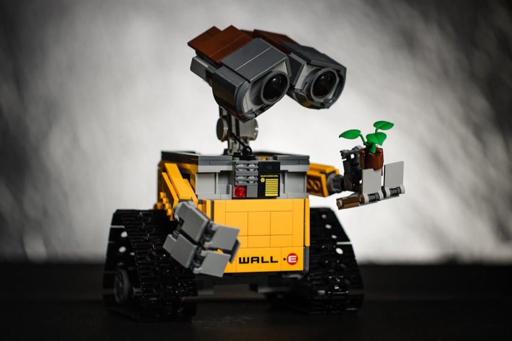Humanoid robots moving along an automated factory assembly line